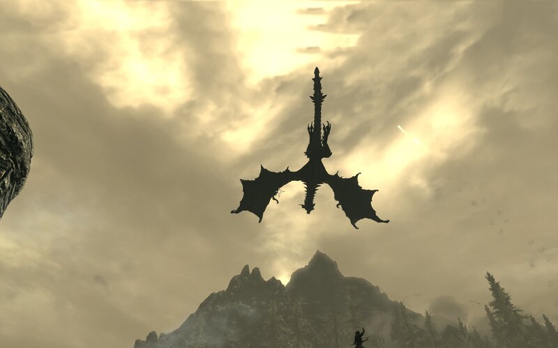 dragon silhouetted against sky