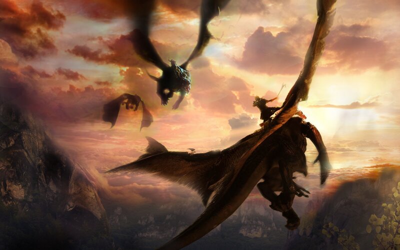 Dragons in flight at sunset