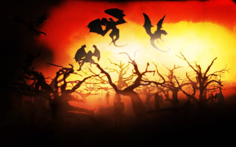 Dragons silhouetted at sunset