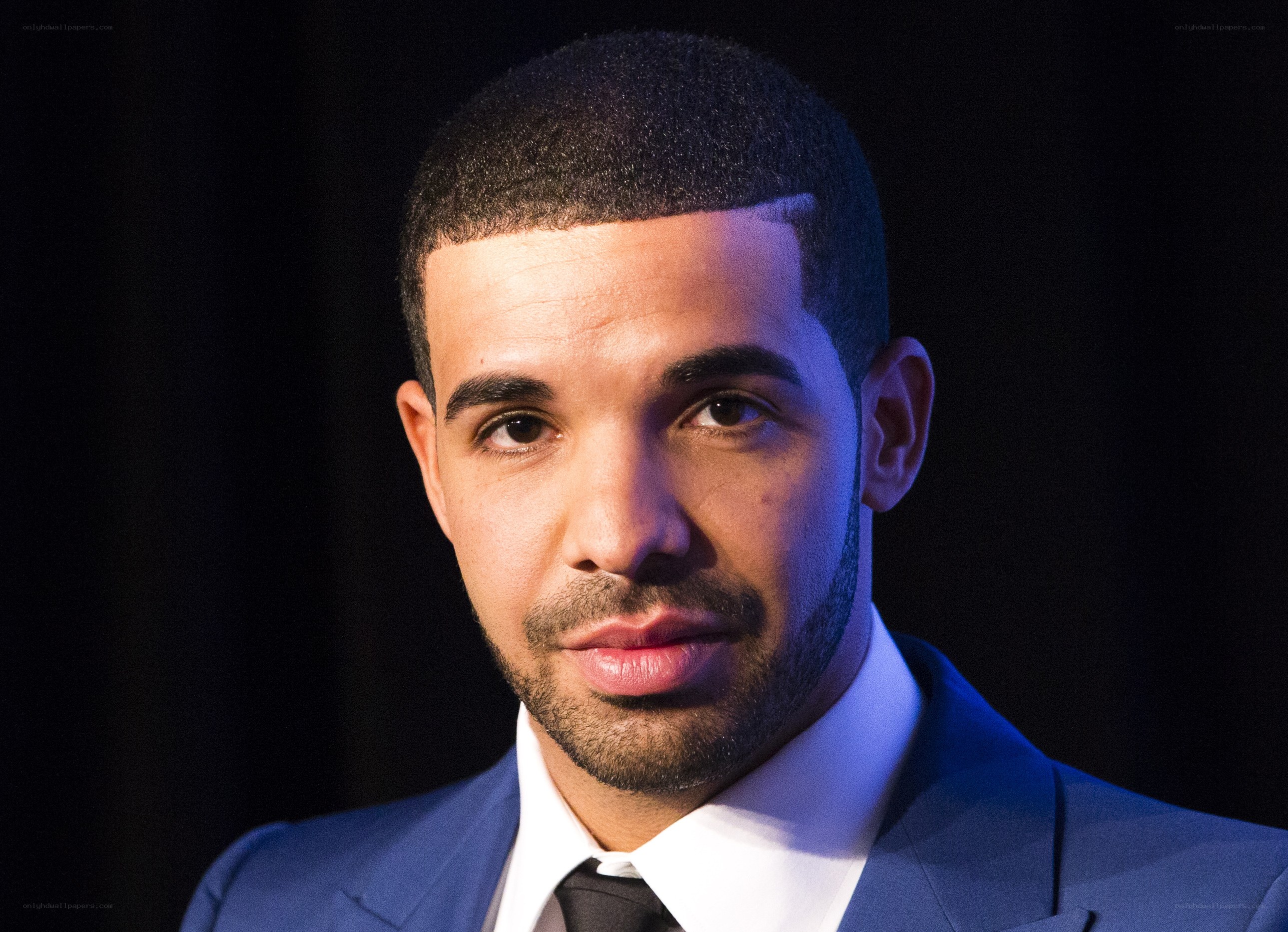 Drake in a blue suit