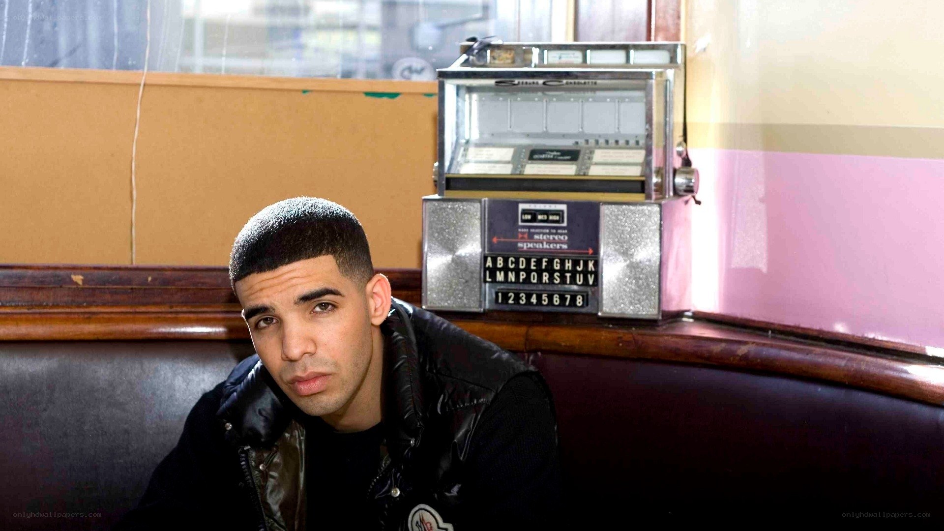 Drake in a diner booth