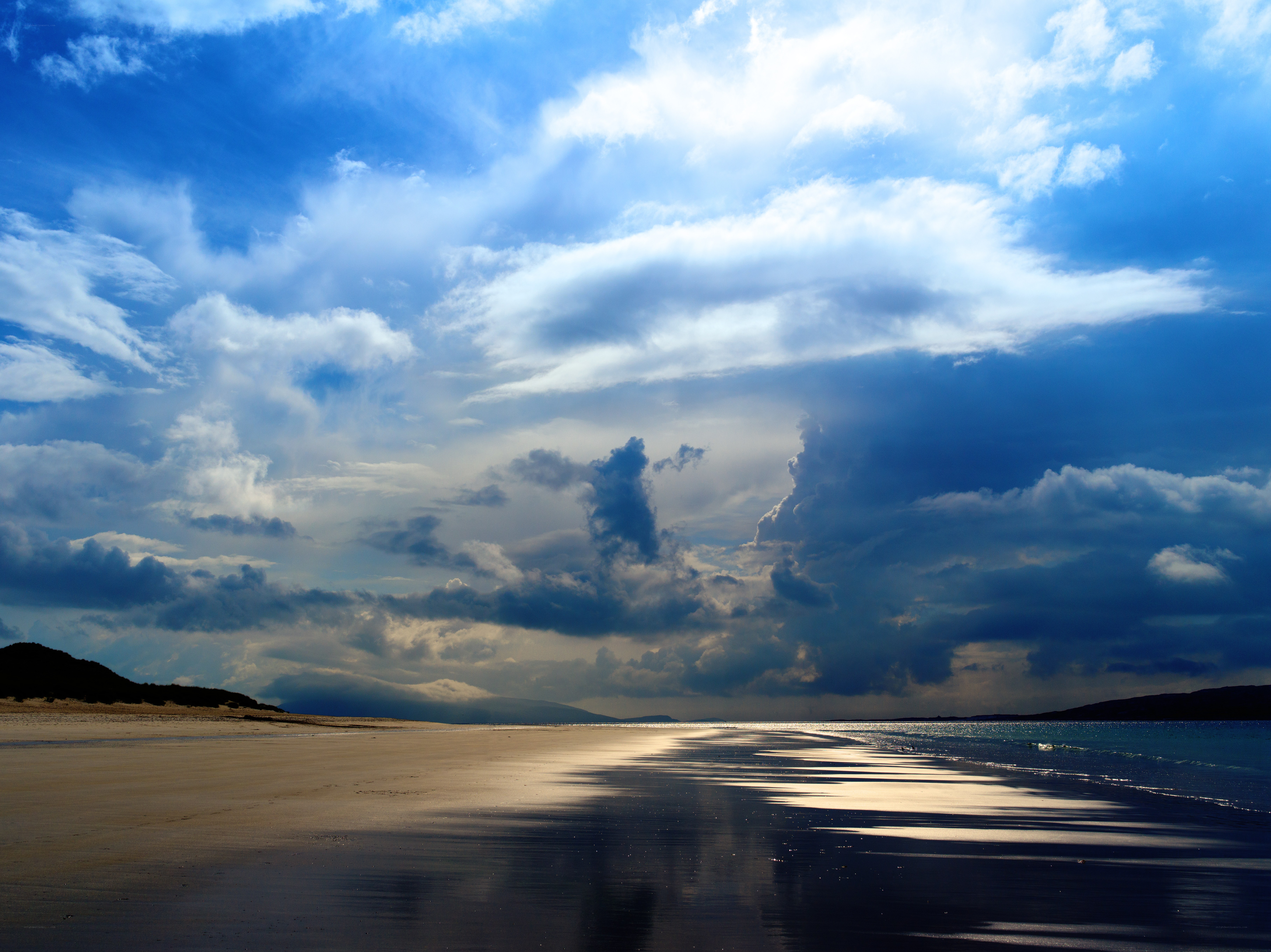 Dramatic beach under stormy sky