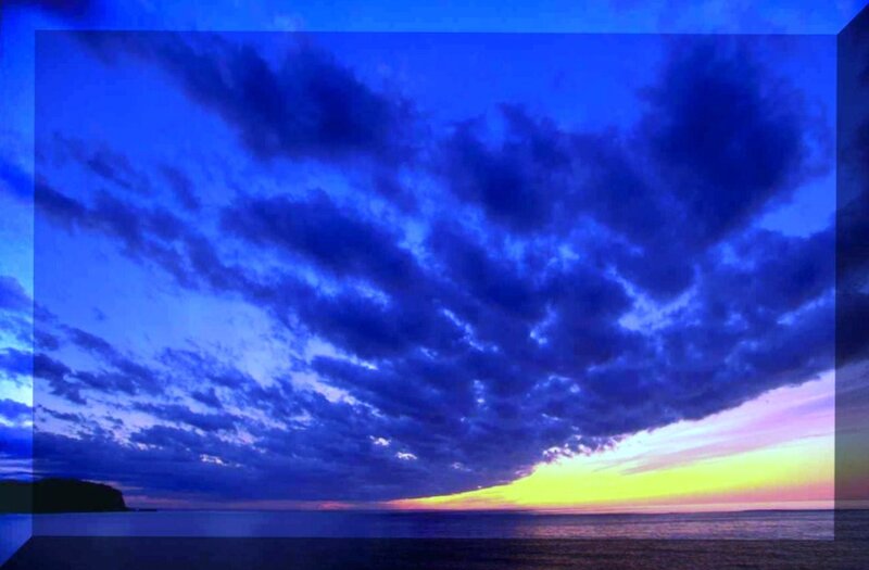 dramatic blue sky over ocean