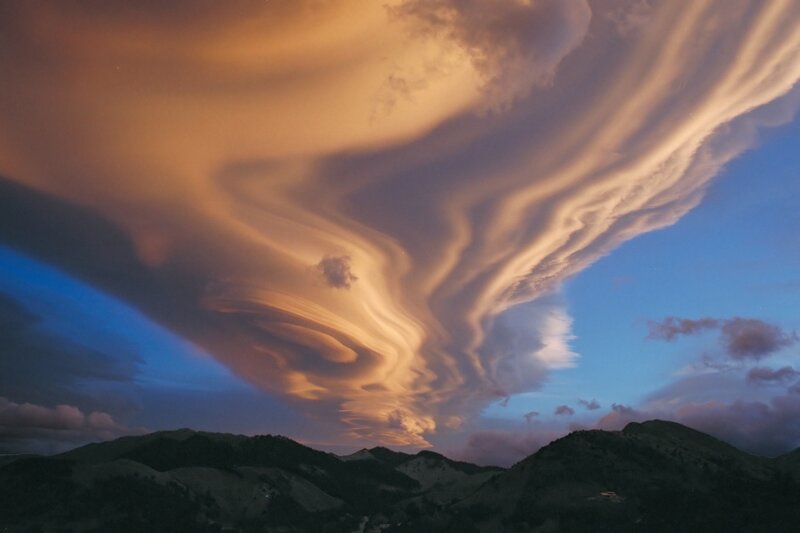 Dramatic cloud formations over mountains