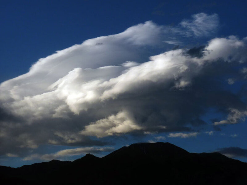 dramatic cloud over mountains
