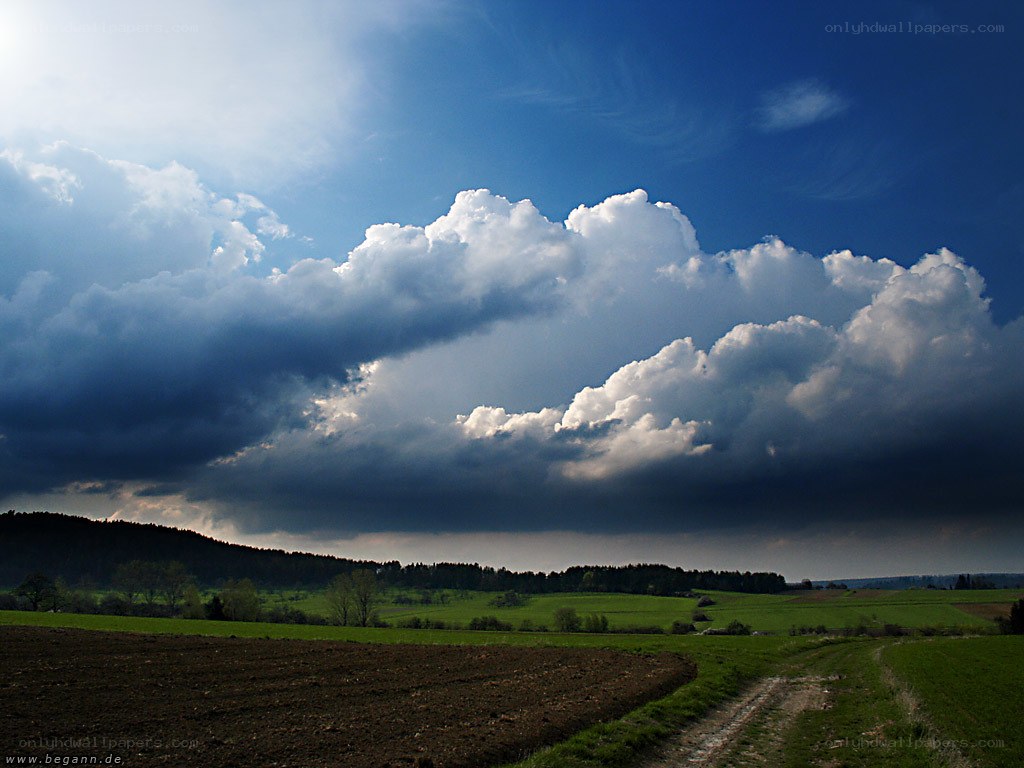 Dramatic clouds over a rural landscape
