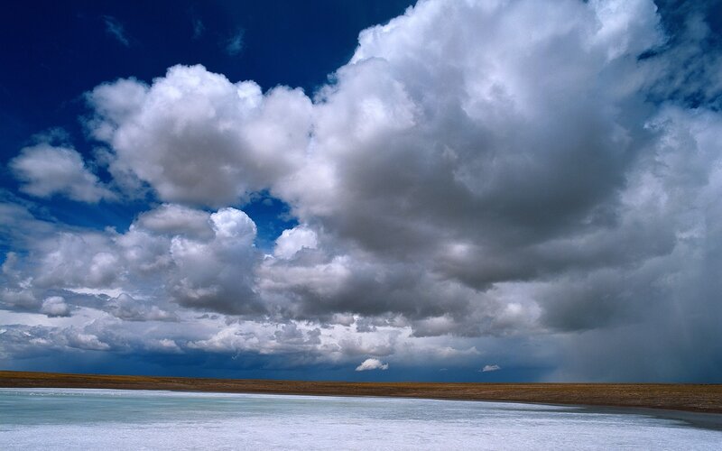 Dramatic clouds over a salt flat