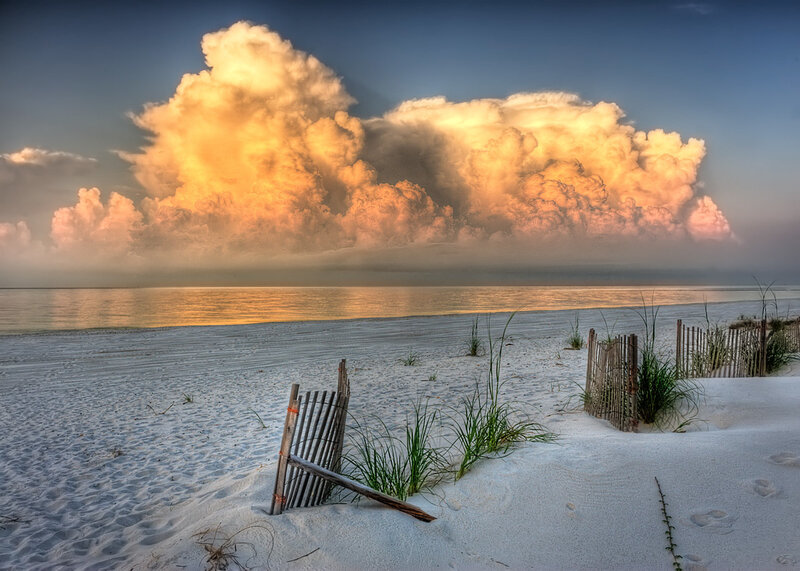 Dramatic clouds over a sandy beach