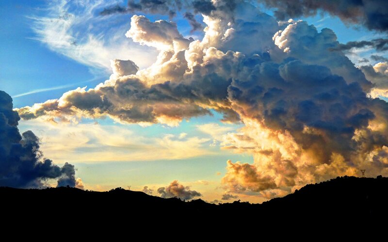 Dramatic clouds over hills