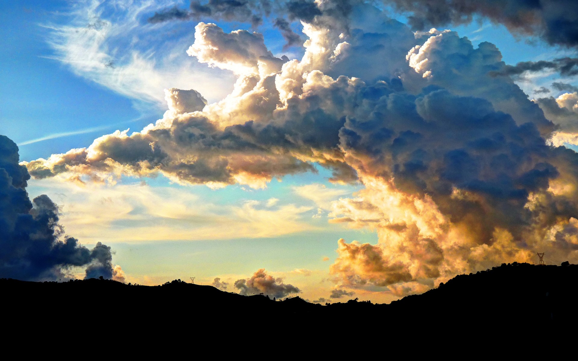 Dramatic clouds over hills