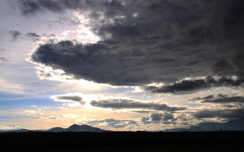 dramatic clouds over mountains