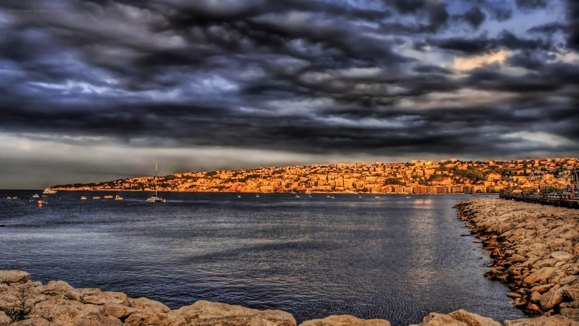 Dramatic coastal cityscape at dusk