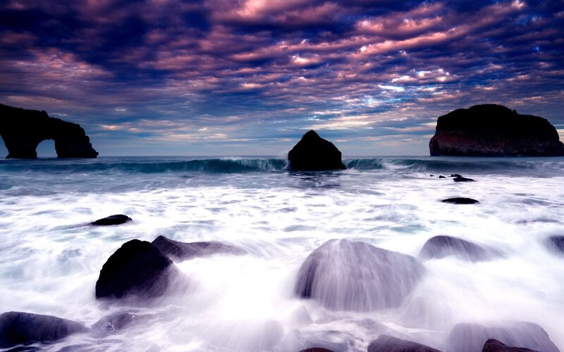 dramatic coastal rocks at sunset
