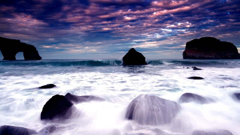 dramatic coastal rocks at sunset