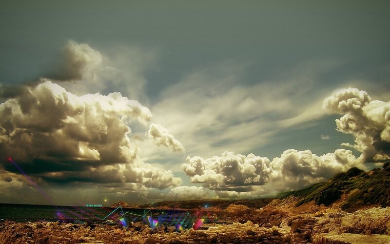 Dramatic coastal sky with laser lights