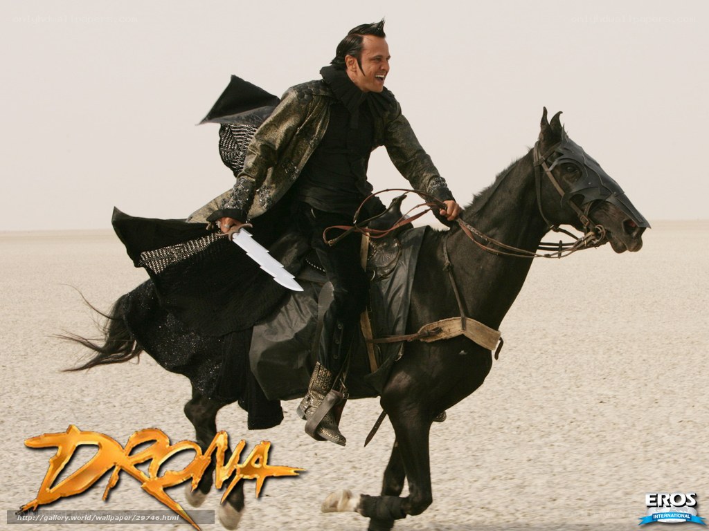 Dramatic horseback rider in desert