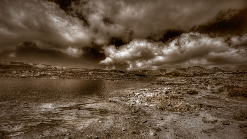 Dramatic lake under stormy sky