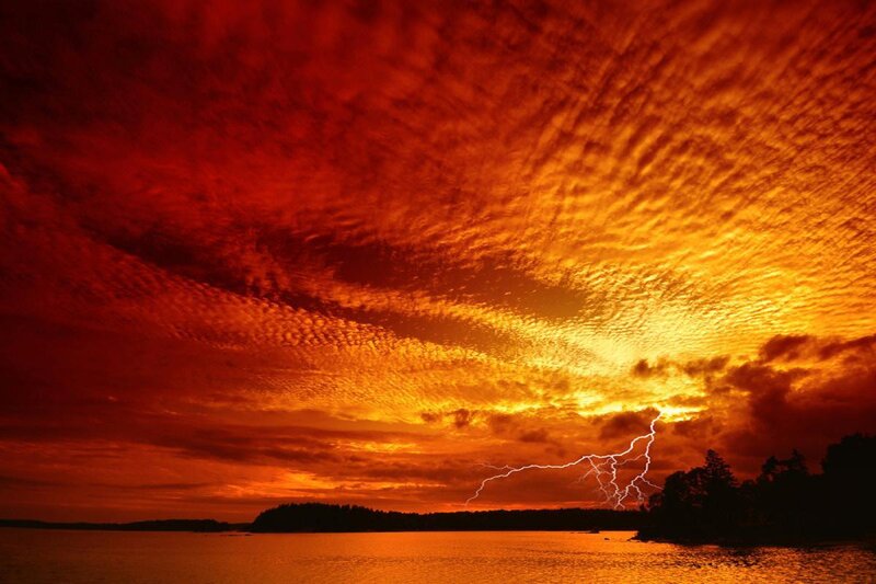 Dramatic lightning over a lake