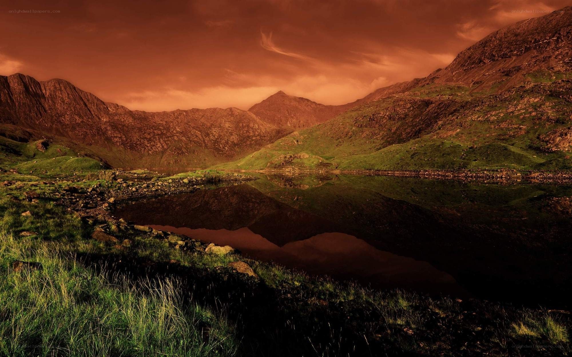 dramatic mountain lake at sunset