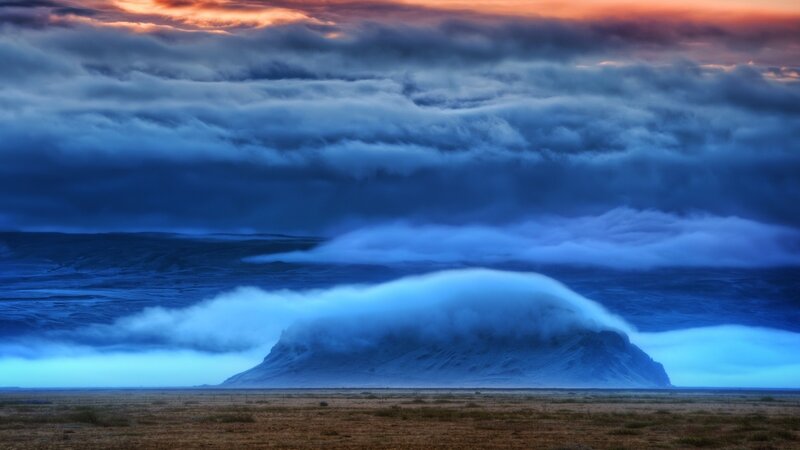Dramatic mountain under stormy sky