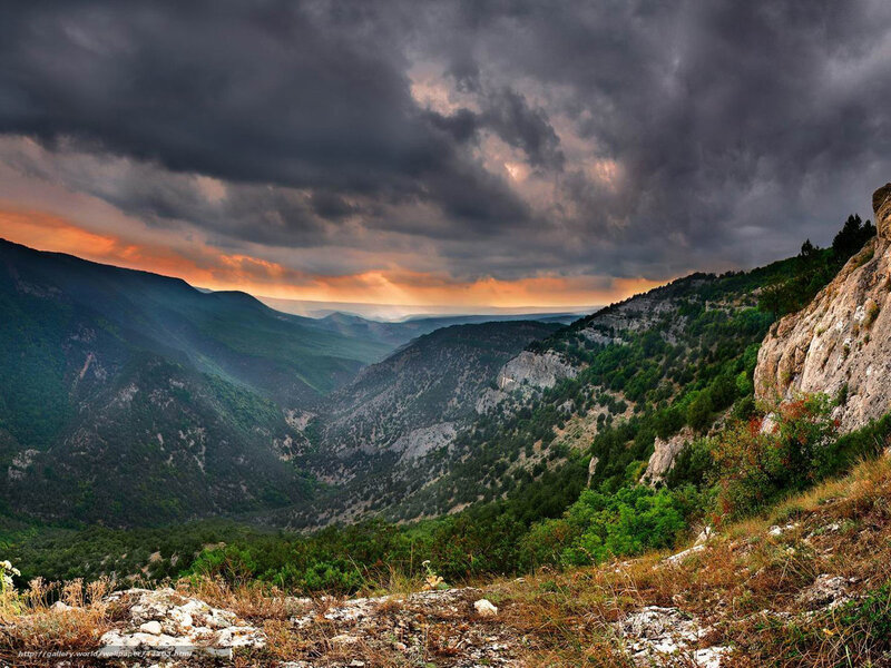 Dramatic mountain valley at sunset
