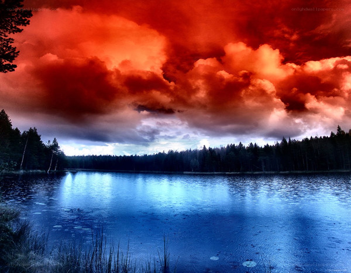 dramatic red sky over lake