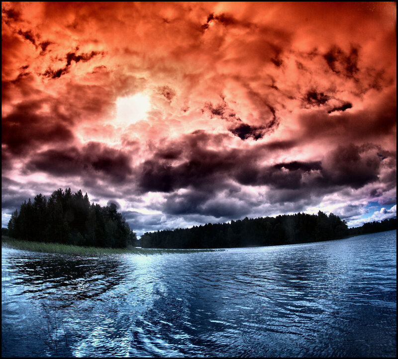 dramatic red sky over lake