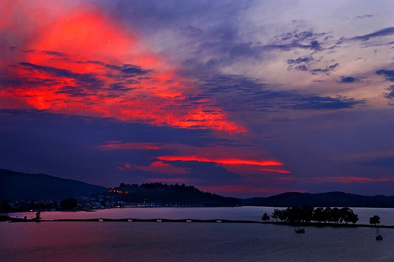 dramatic red sunset over lake