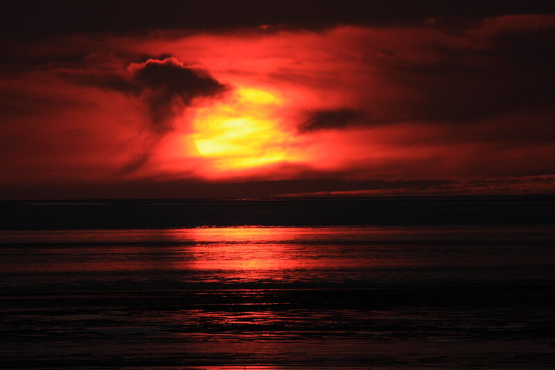 dramatic red sunset over water