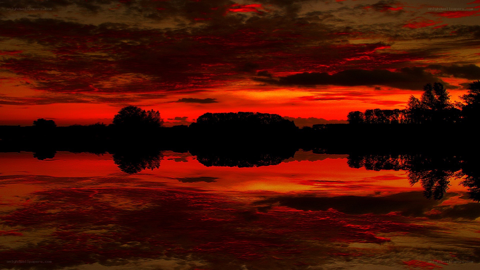 dramatic red sunset over water