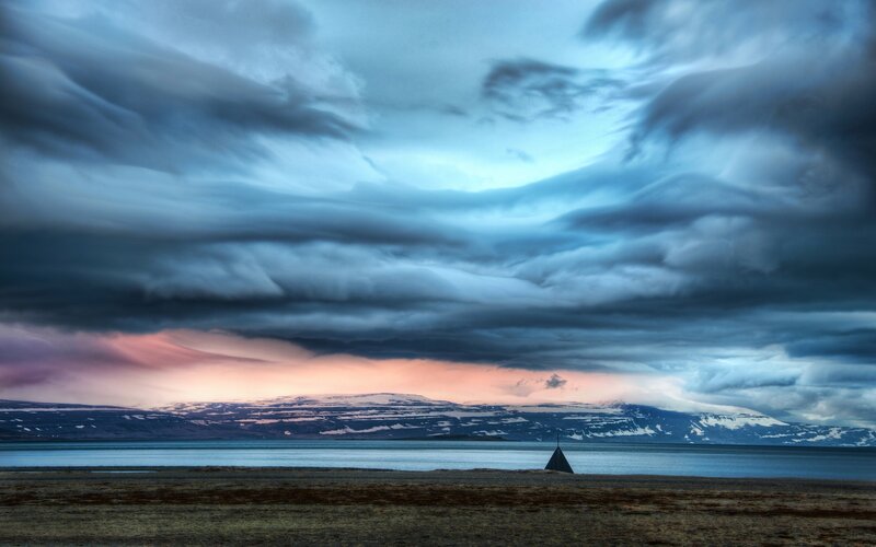 Dramatic sky over a coastal landscape