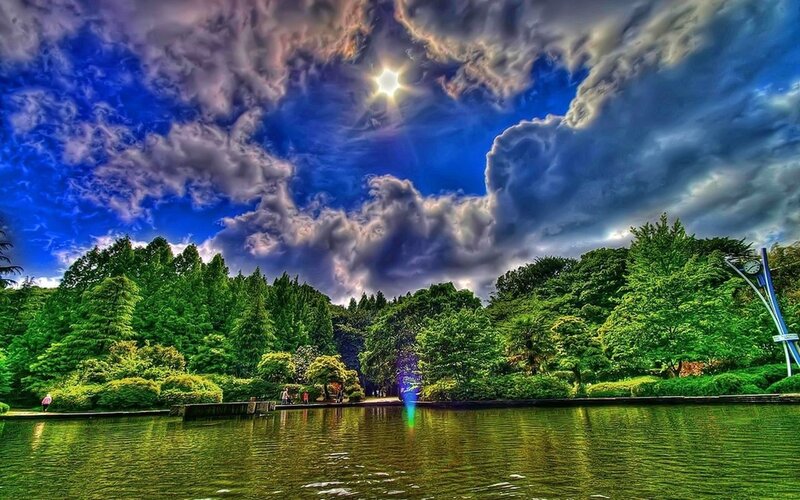 Dramatic sky over a park lake