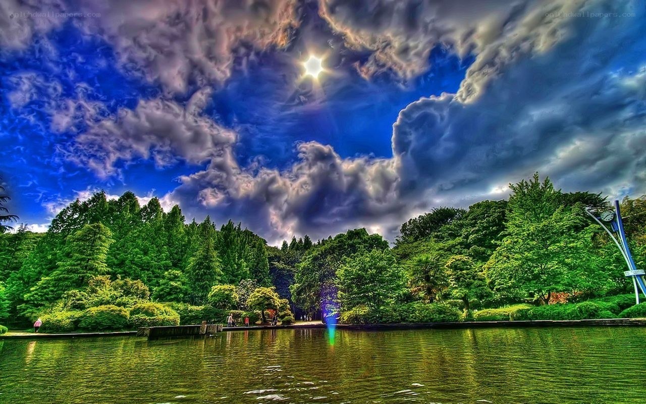 Dramatic sky over a park lake