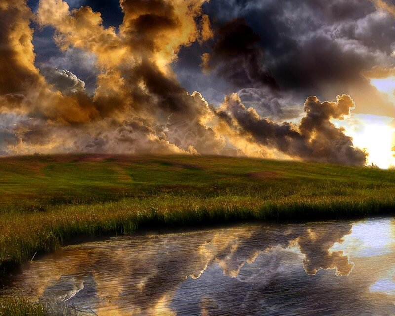 Dramatic sky over a serene field