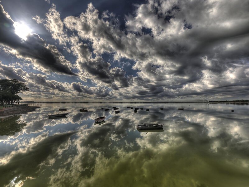 Dramatic sky over calm lake