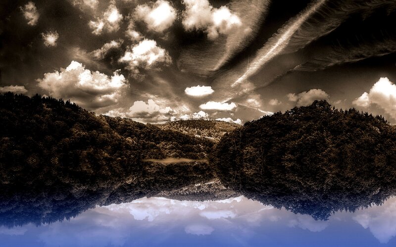 Dramatic sky over forested hills