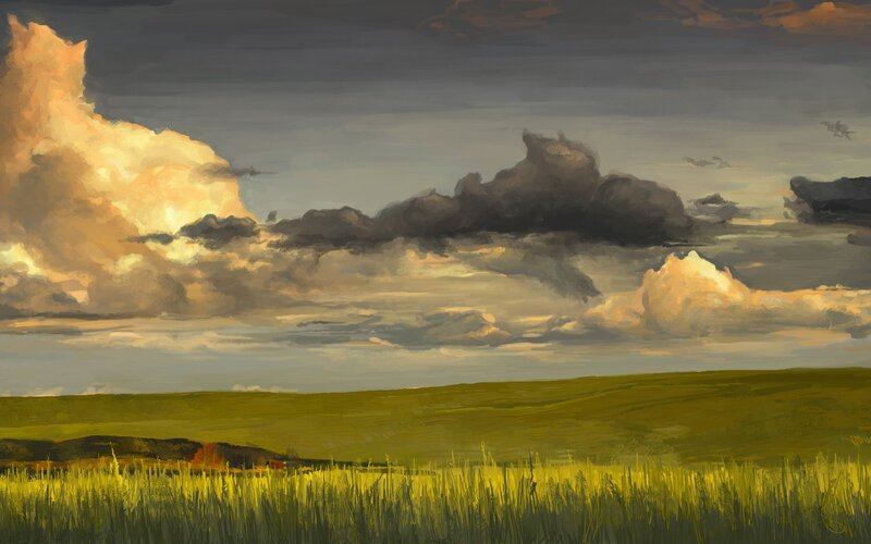 Dramatic sky over green fields