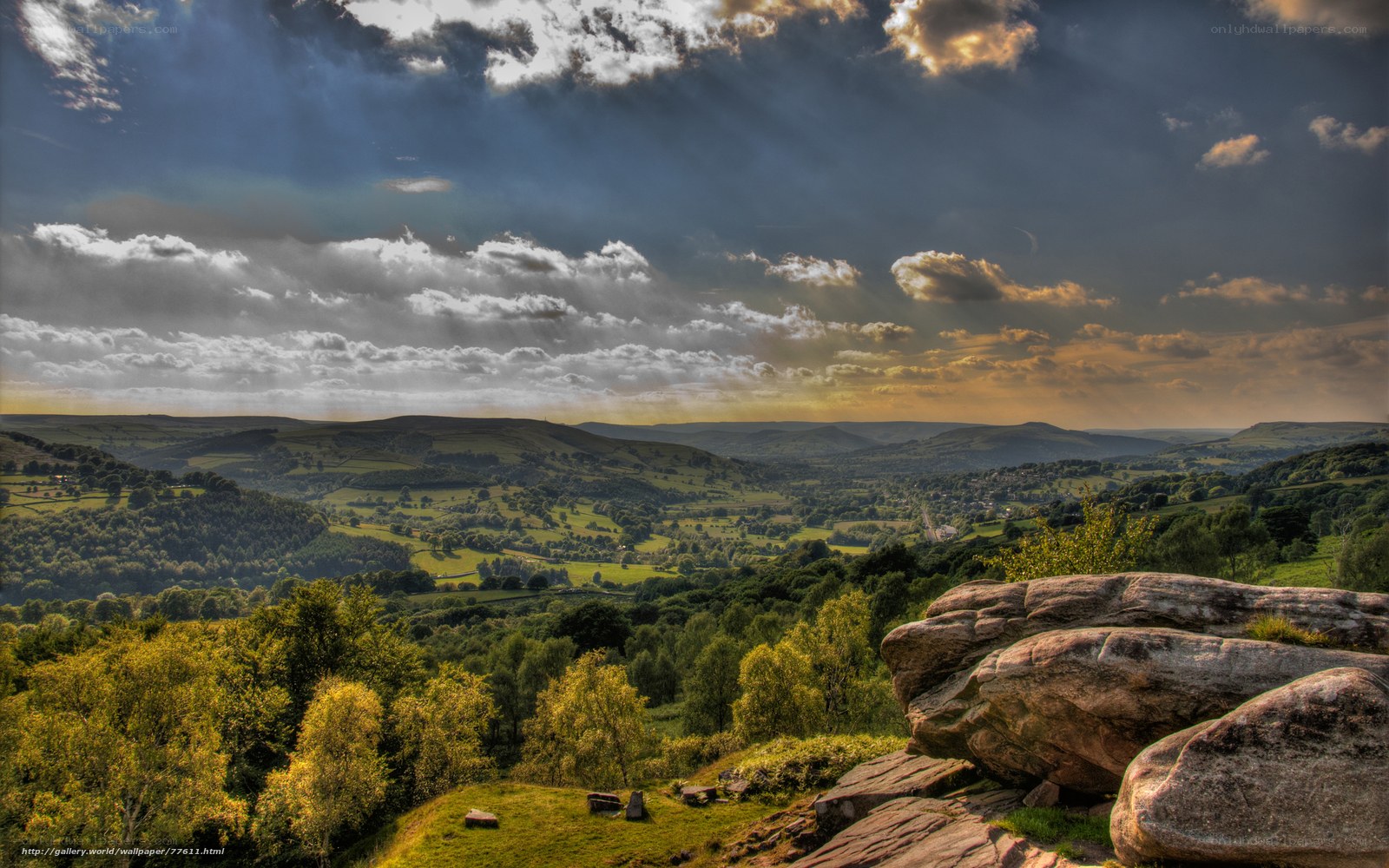 dramatic sky over green hills