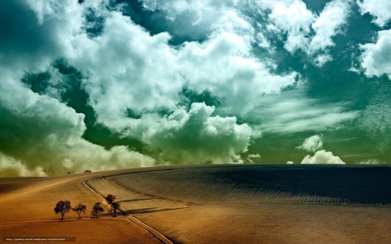 Dramatic sky over plowed field