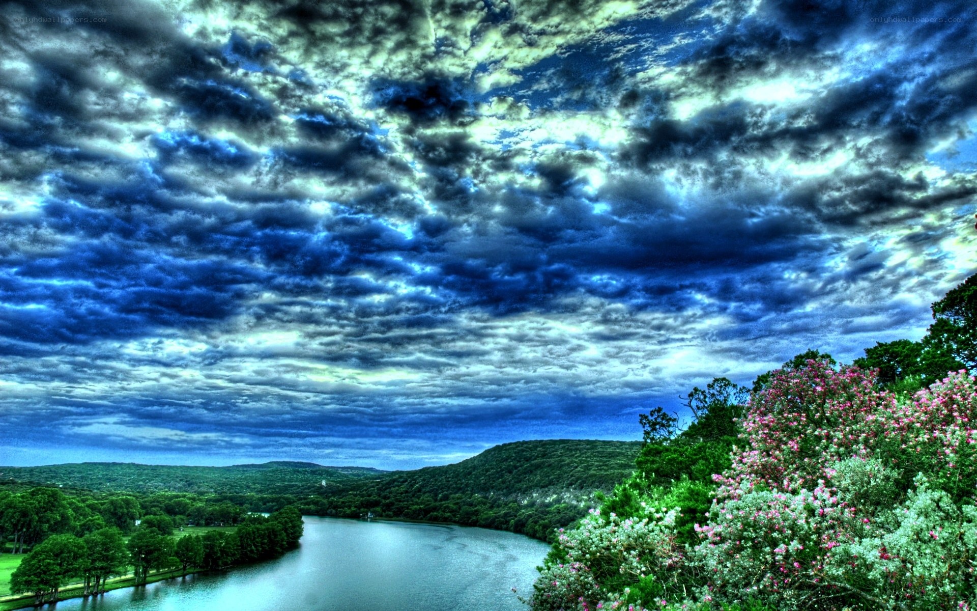 Dramatic sky over river landscape