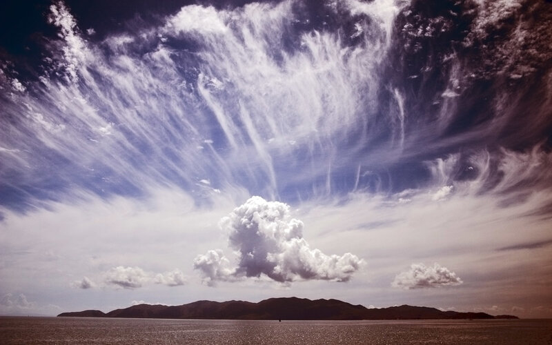 Dramatic sky over sea and mountains