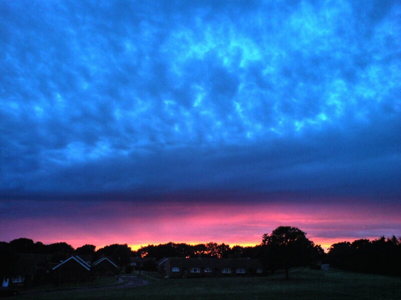Dramatic sky over suburban homes