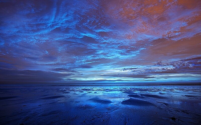 dramatic sky over wet beach