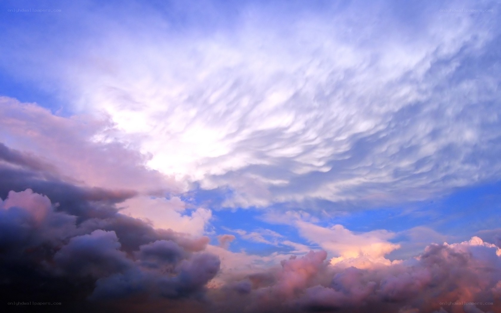 Dramatic sky with pink and blue clouds
