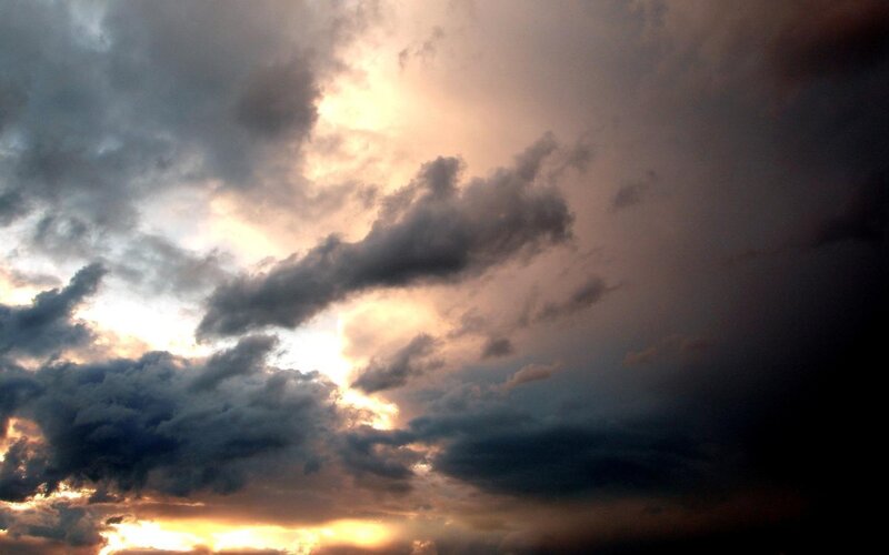 dramatic storm clouds at sunset