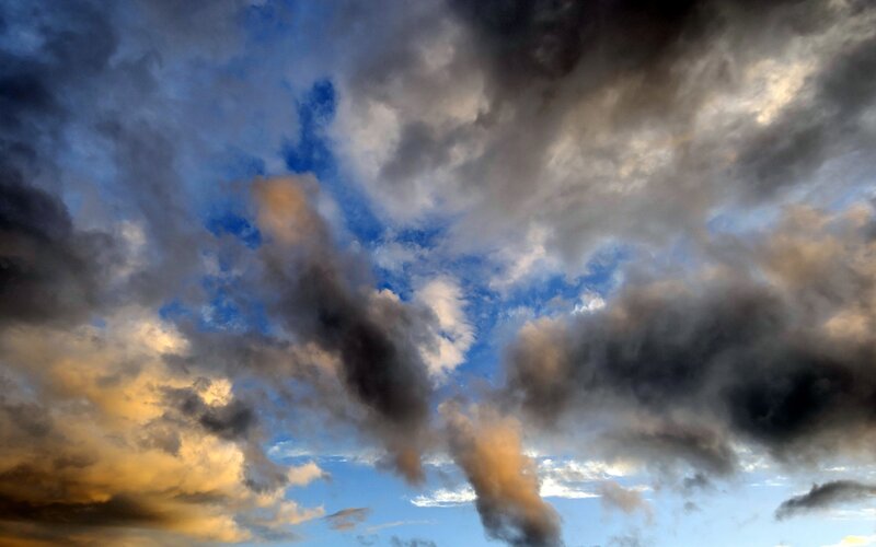 dramatic storm clouds at sunset