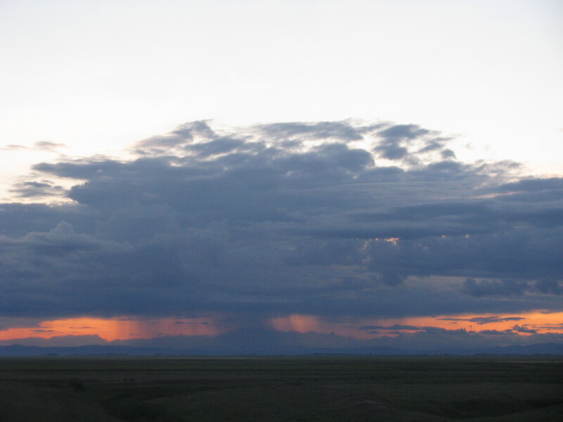 dramatic storm clouds at sunset