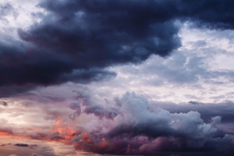 dramatic storm clouds at sunset