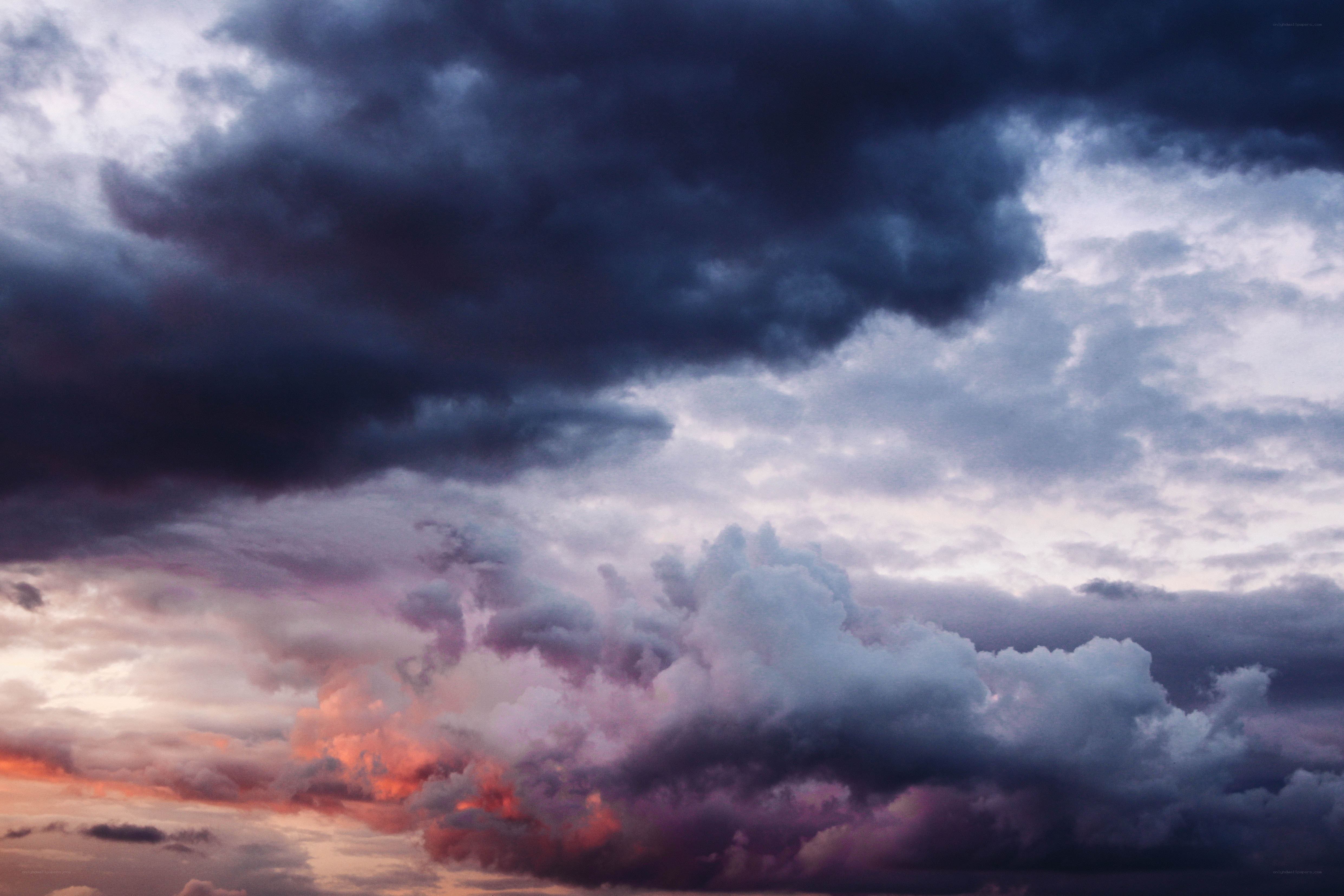 dramatic storm clouds at sunset