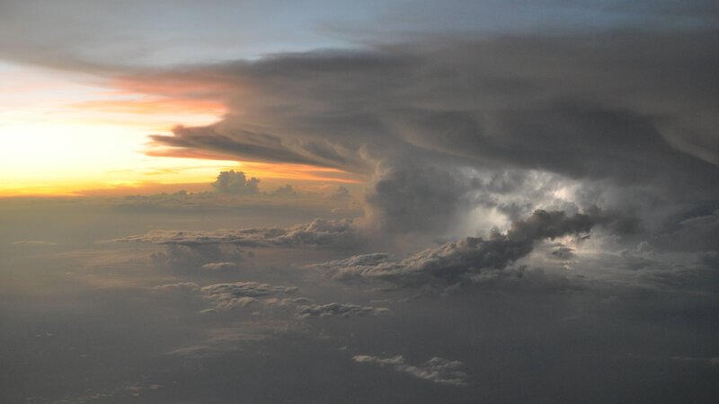 dramatic storm clouds at sunset